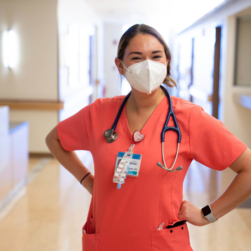 young smiling nurse wearing a mask 
