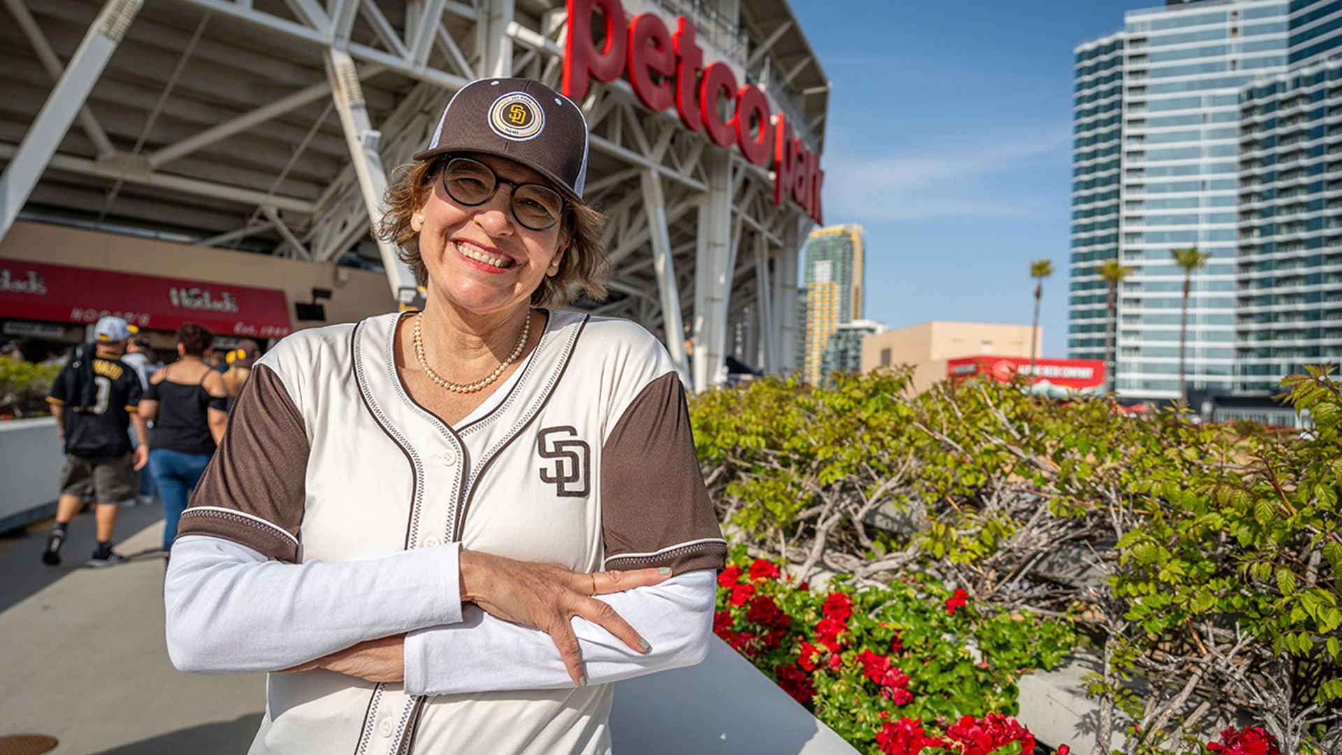 Alison Moore in front of Petco Park arms crossed