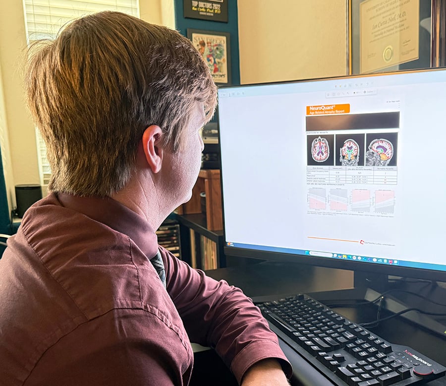 Ian Neel sitting at his computer