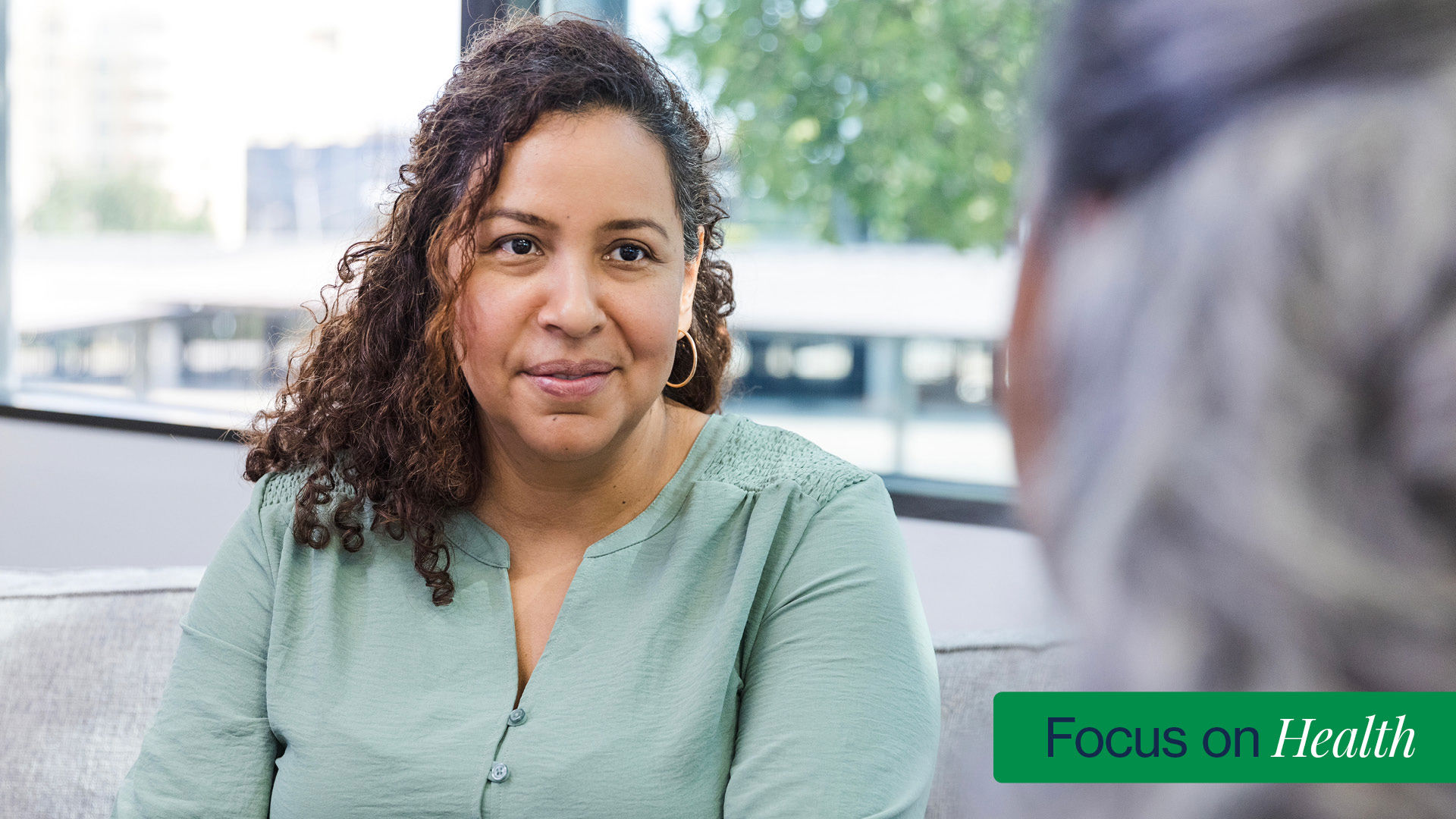 Female patient talks with mental health provider